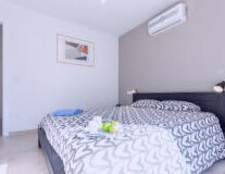 a bedroom with a bed in a room